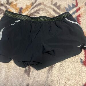 Nike Black Women's Athletic Shorts with Yellow Accents